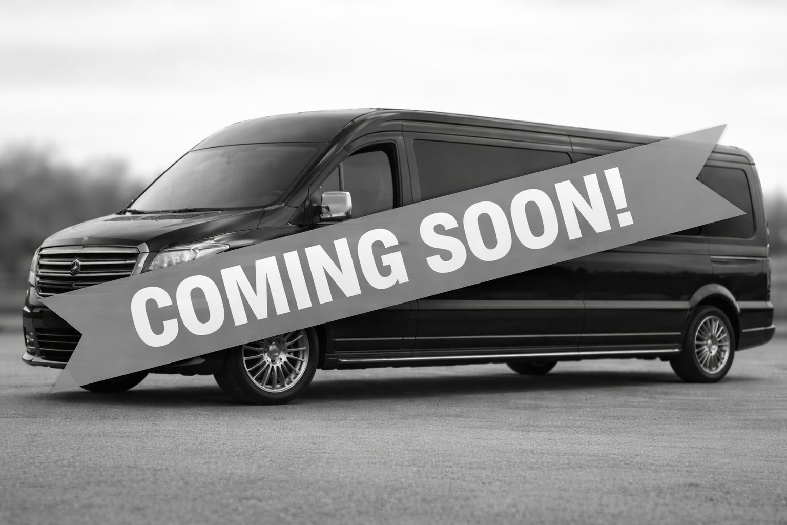 Black van with coming soon banner